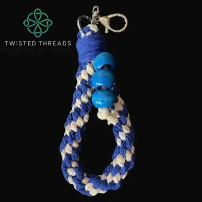 chunky navy crown knot keychain with 3 wooden beads on black background