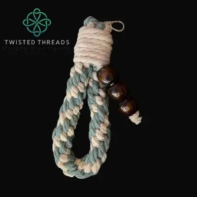 chunky sage crown knot keychain with 3 wooden beads and metal clasp on black background