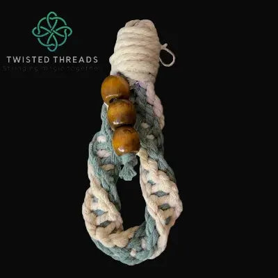 chunky sage double spiral knot keychain with 3 wooden beads on black background